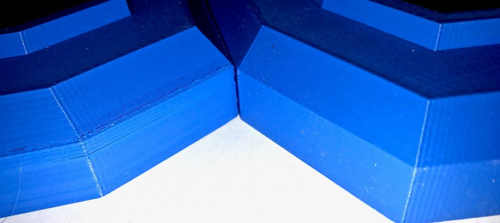 Close-up of the base parts showing the rear (left) and front (right)